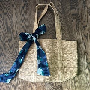 Draper James every day natural straw bag with navy floral scarf.